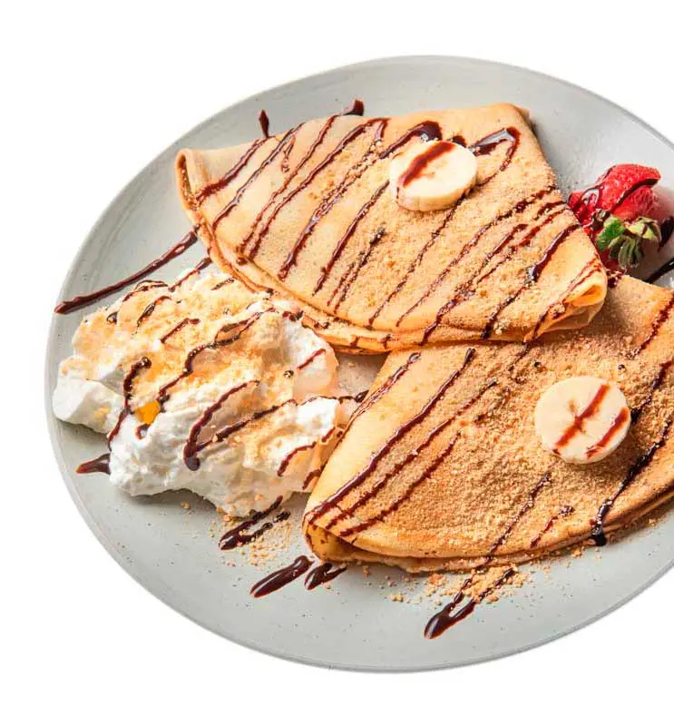 Sweet crêpes drizzled with chocolate at Café Korzo